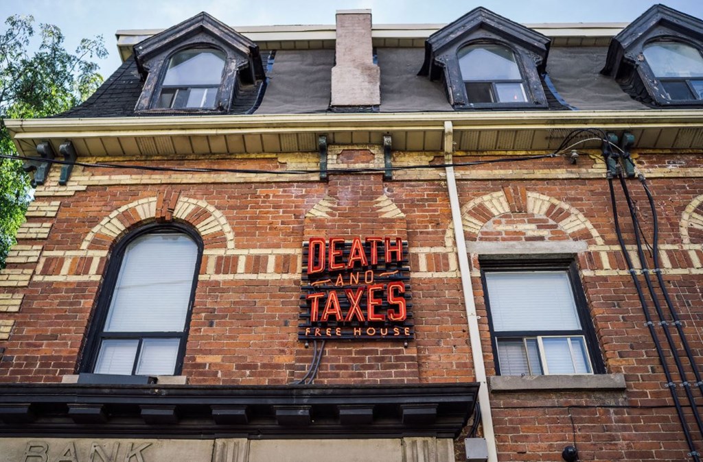 a sign on the side of a brick building