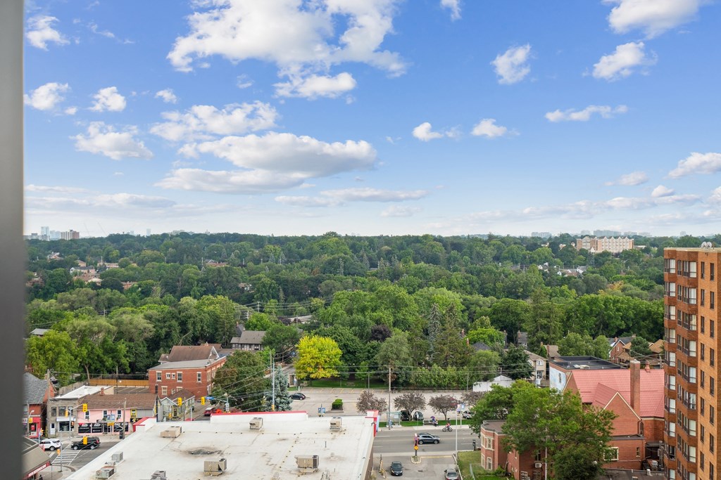 the view of the city from the roof of a building