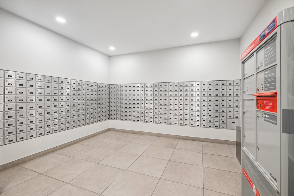 the laundry room has tile flooring and stainless steel appliances