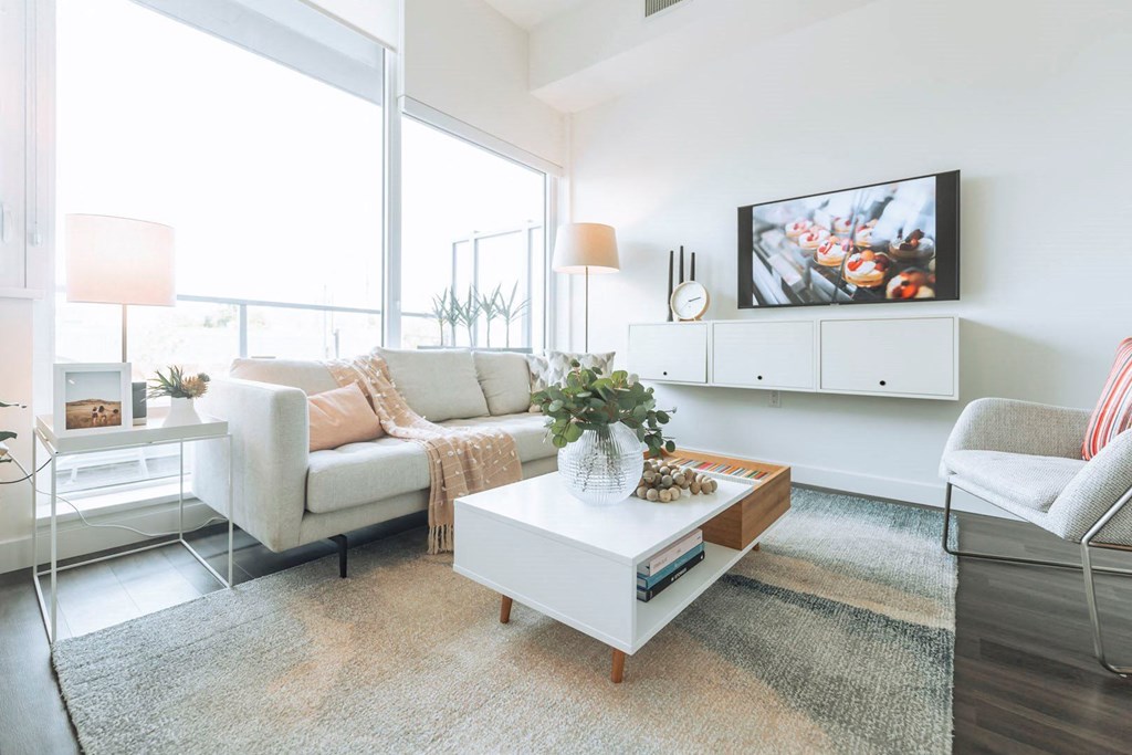 a living room with a couch and a table and a television