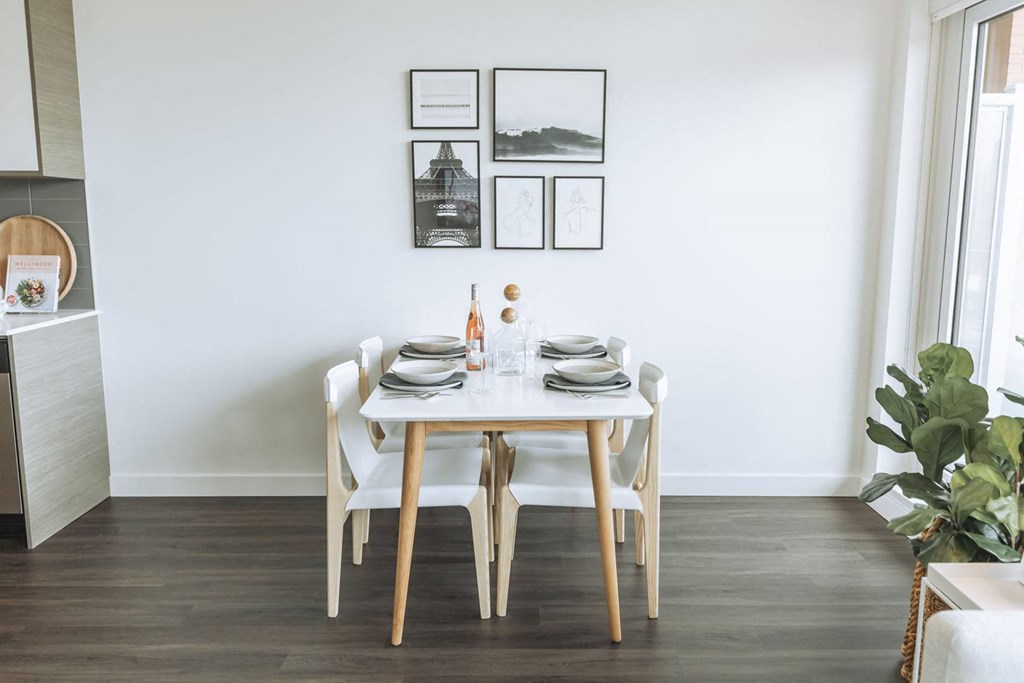 a dining room with a table and chairs