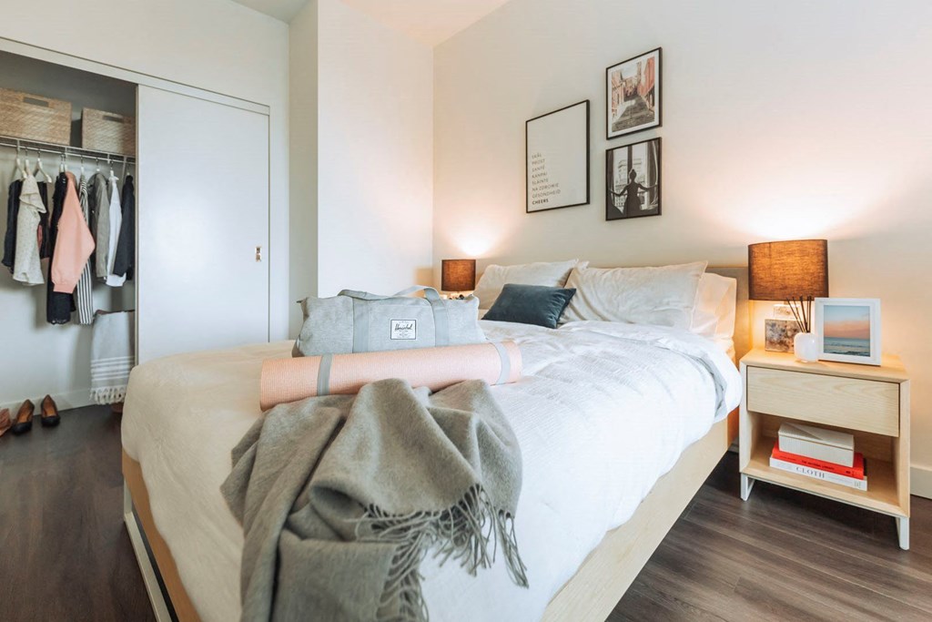 a bedroom with a bed and a closet