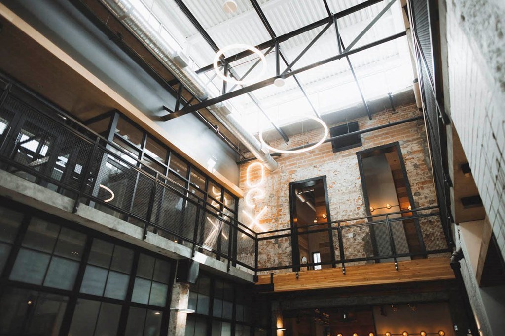 a view of the lobby of a building with a glass ceiling