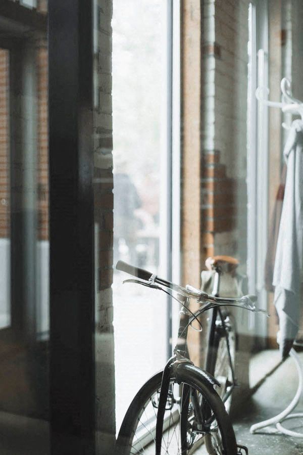 a bike parked in front of a window