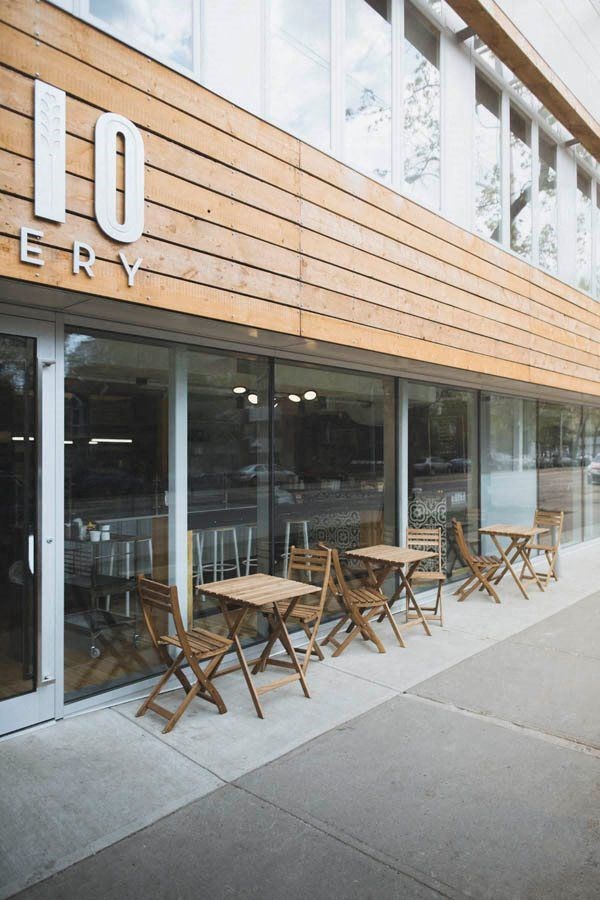 a group of tables and chairs outside of a restaurant