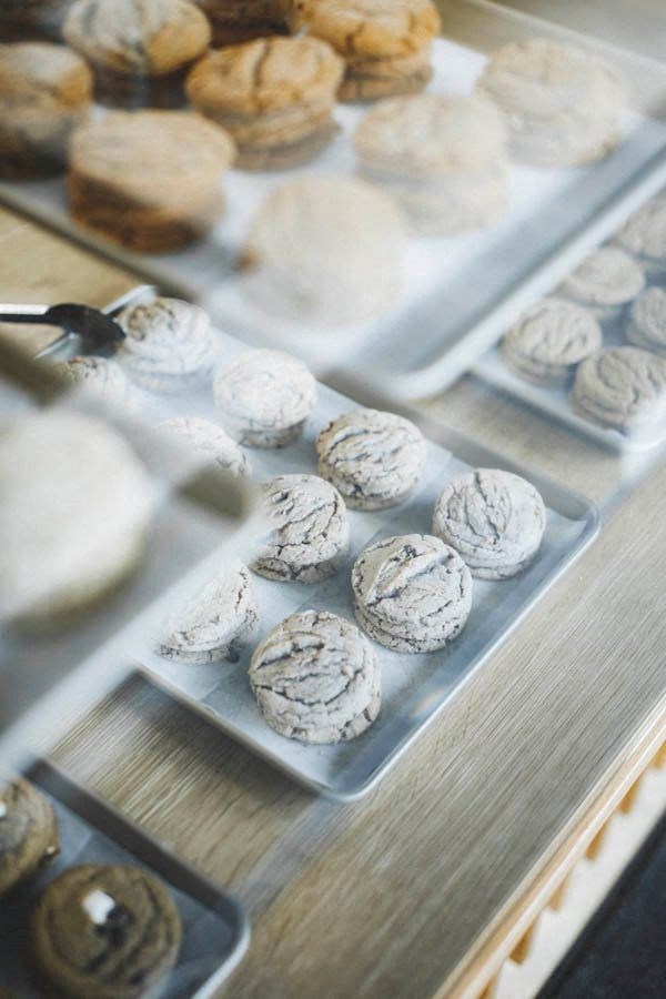 a display of cookies on trays on a table