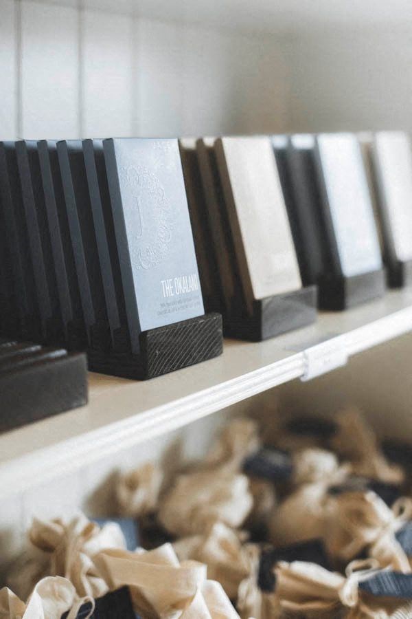 a row of black and white books on a shelf