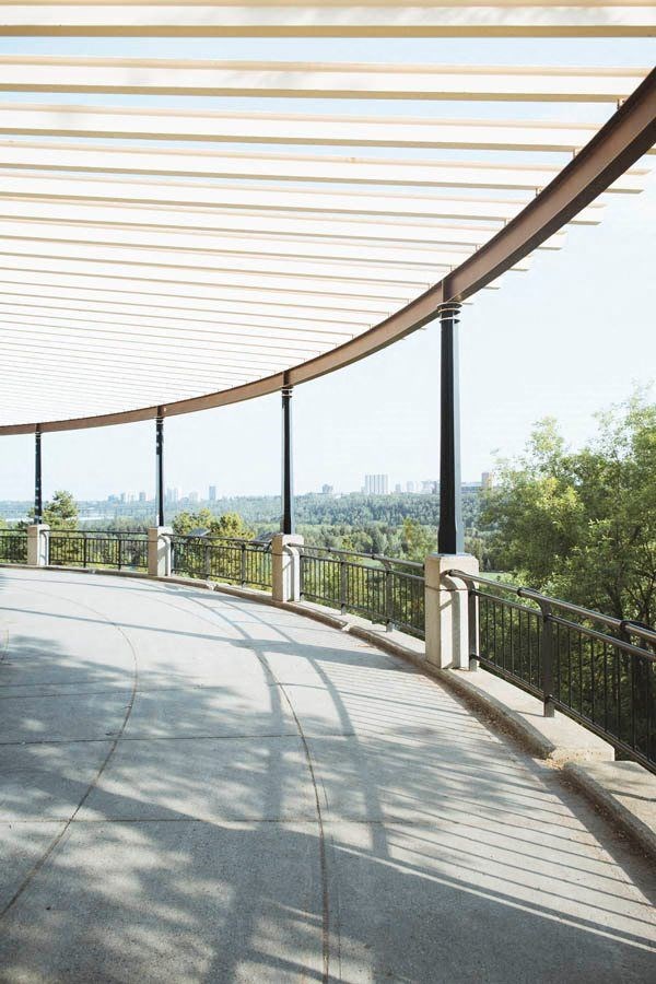 the view of the city from the side of a bridge