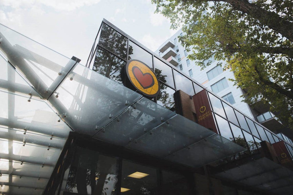 the outside of a restaurant with the logo on the building