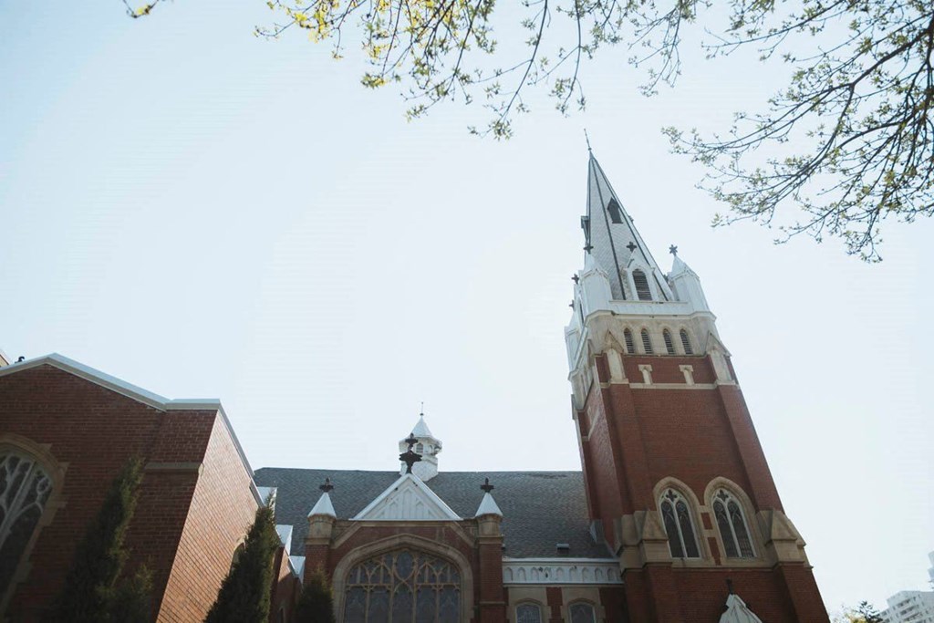 the steeple of a church with a sky background