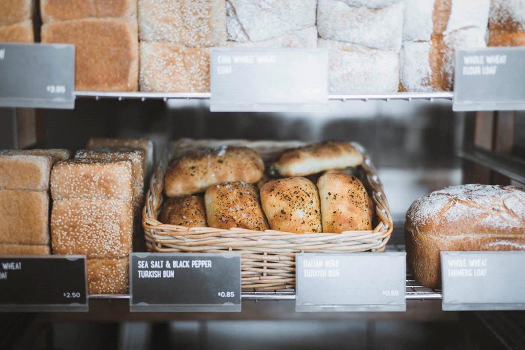 a display of bread and other baked goods in a bakery