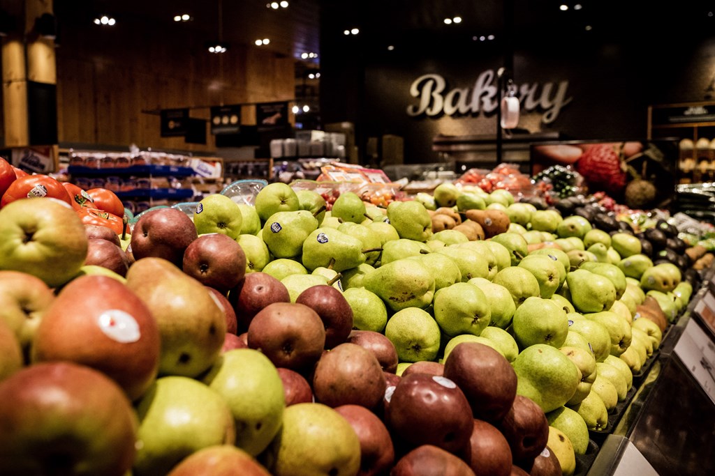 red apples and green apples on display next to each other