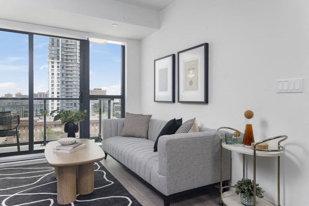 a living room with a couch and a large window