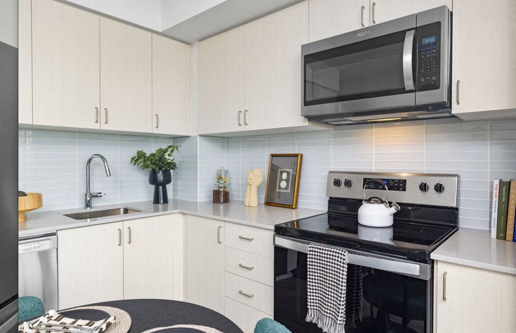 a kitchen with a stove and a microwave