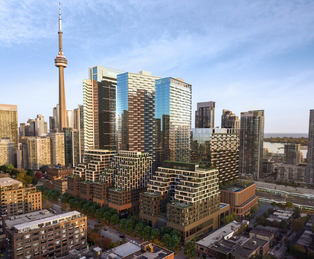A cityscape with a variety of buildings, including a tall tower in the background.