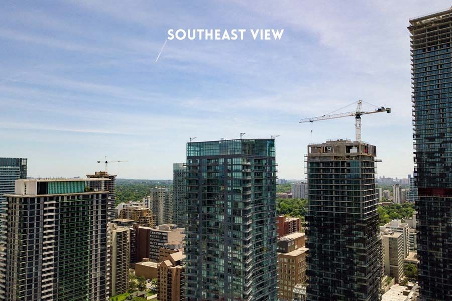 a view of the city with skyscrapers and a crane