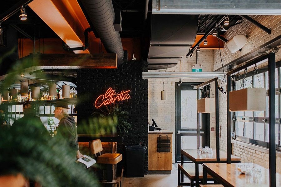 a restaurant with a coca cola sign on the wall