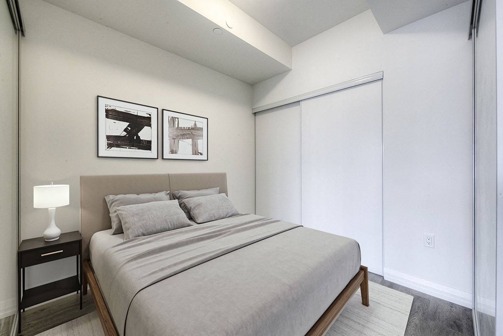 a bedroom with a large bed and a window