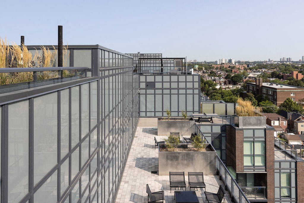 a roof terrace with a view of the city