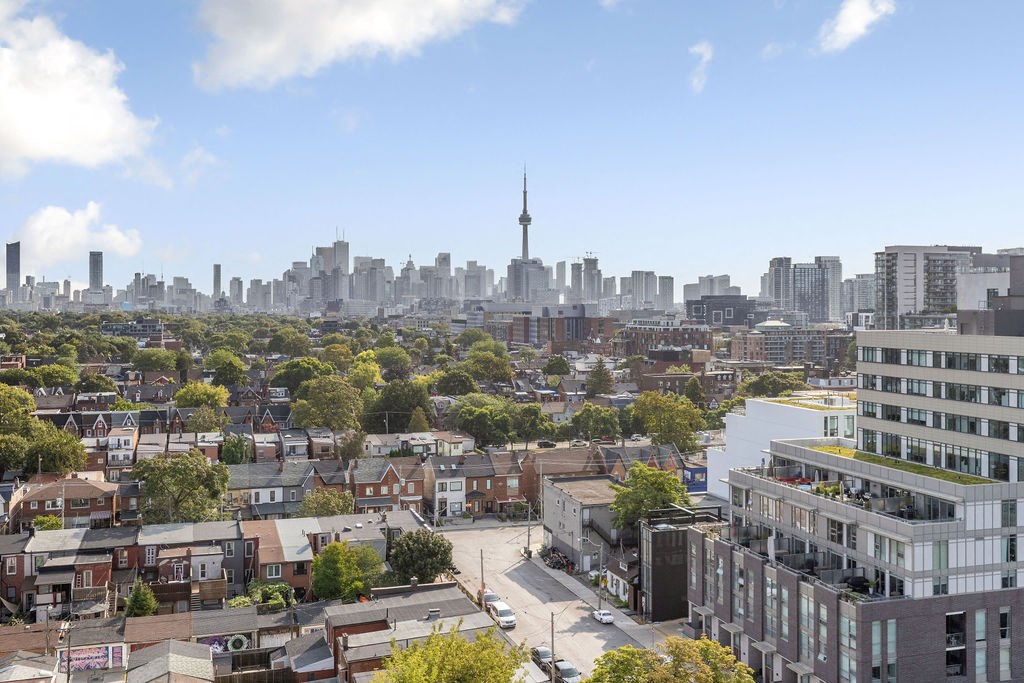 a cityscape of toronto with the cn tower in the distance
