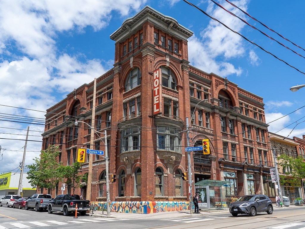a red brick building on the corner of a city street