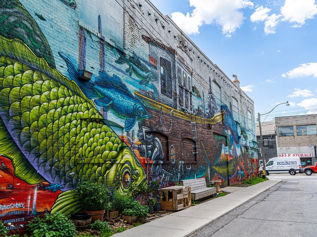 a mural of a fish on the side of a building