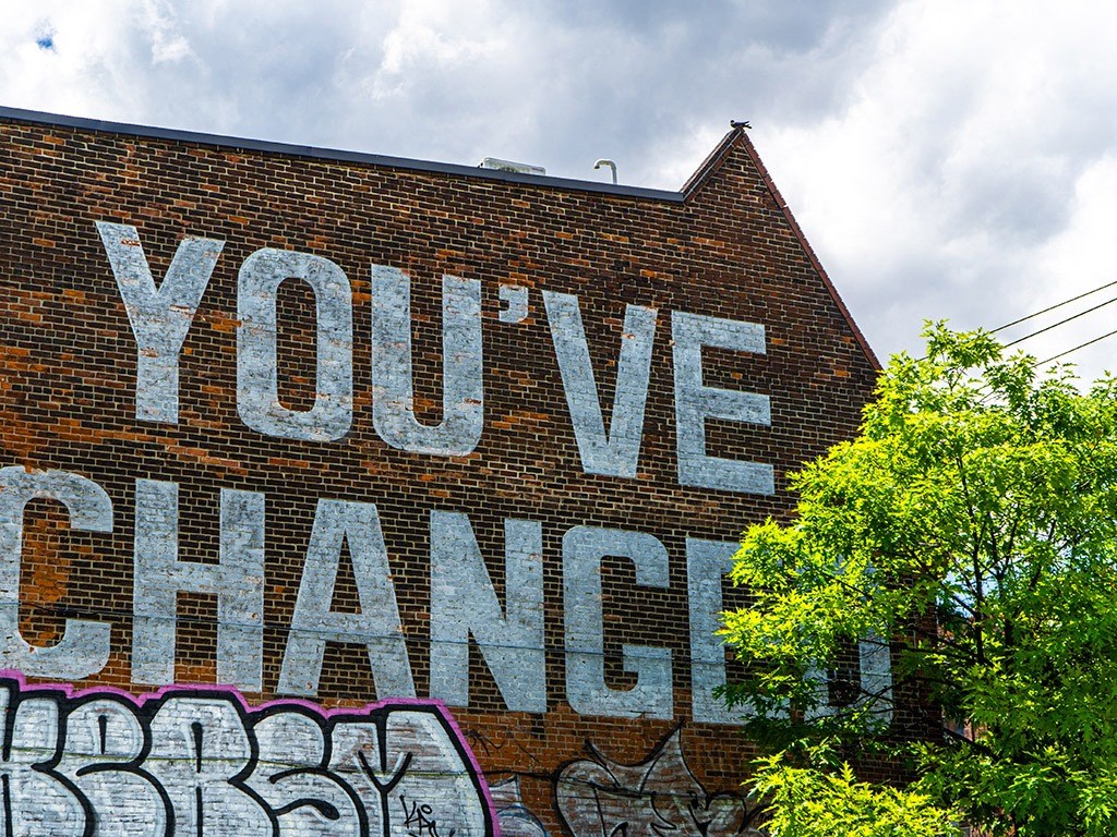 a brick wall with graffiti on it that reads youve changed