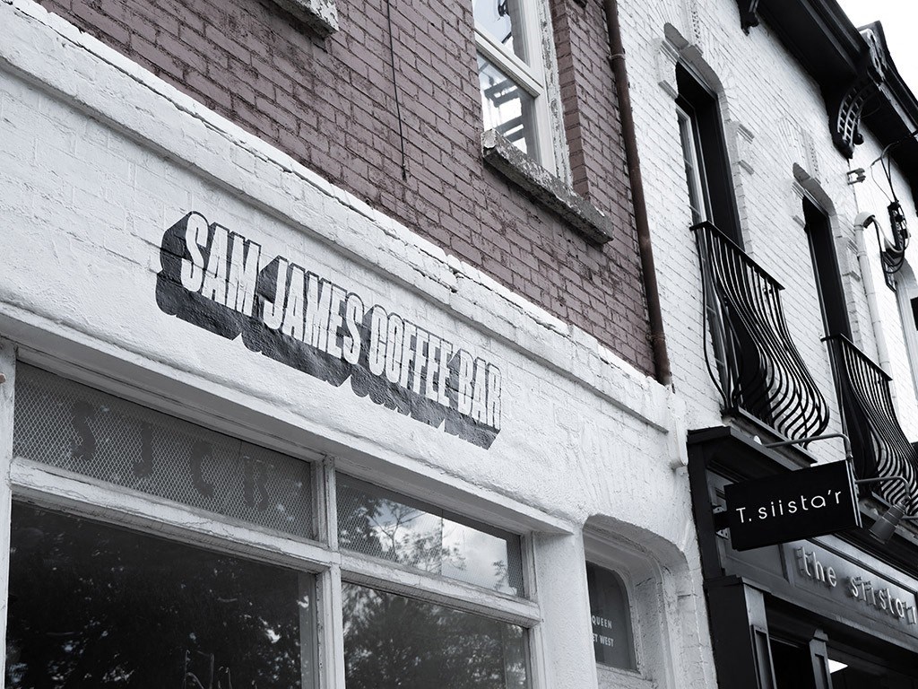 a brick building with a sign on the side of it