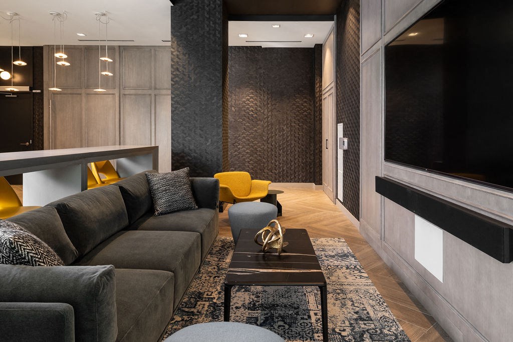 a living room with a couch and a coffee table and a television