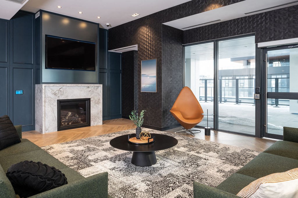 a living room with a fireplace and a tv