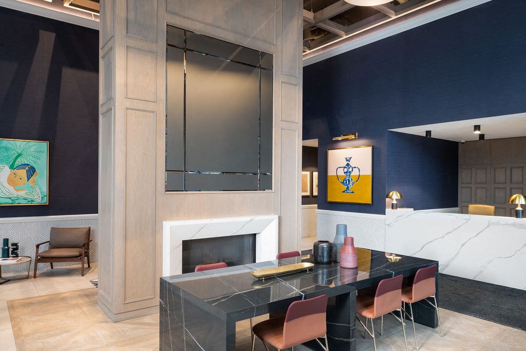 a dining room with a table and chairs and a fireplace
