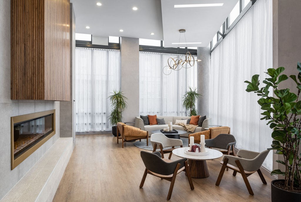 a living room filled with furniture and a fireplace