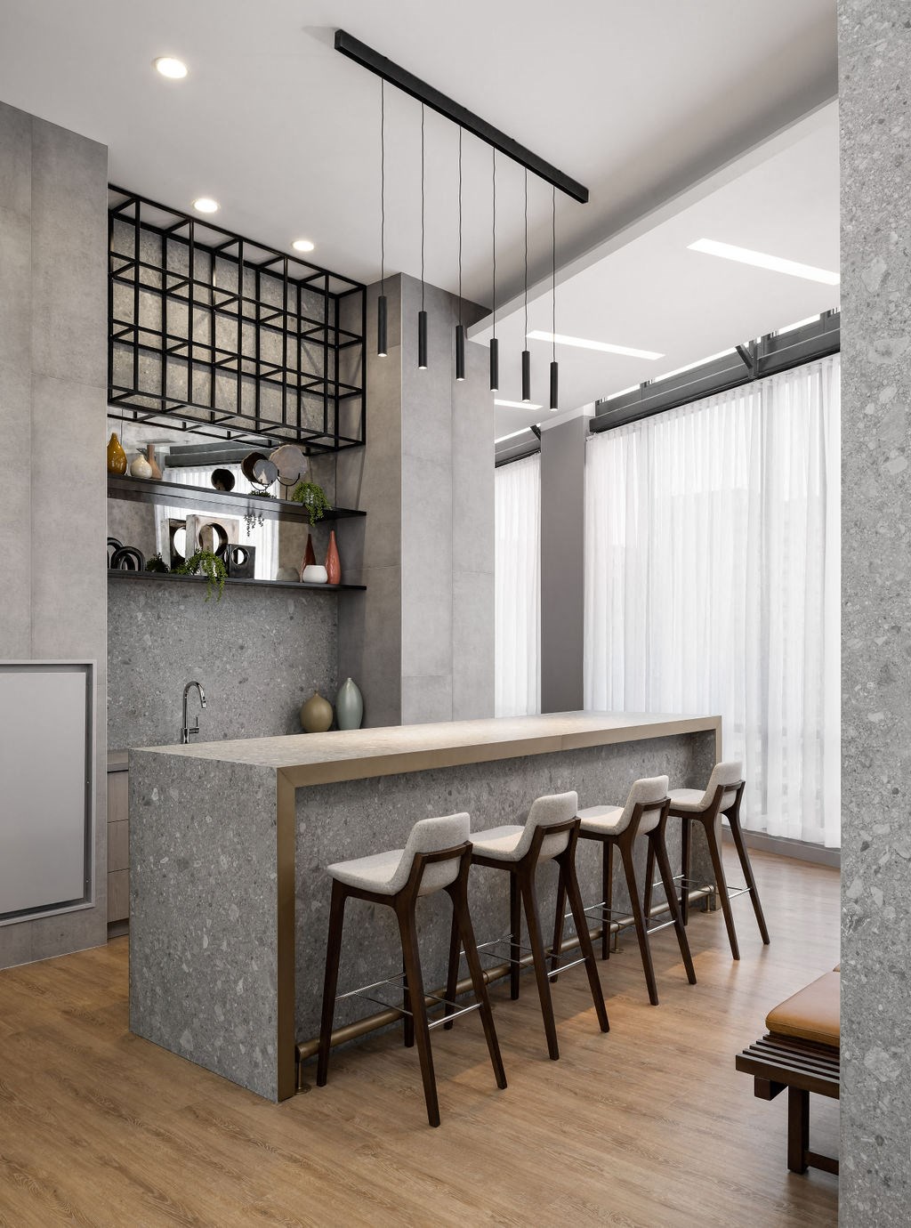 a kitchen with a marble counter top and chairs