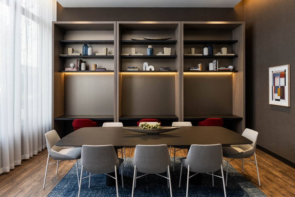 a dining room with a table and chairs