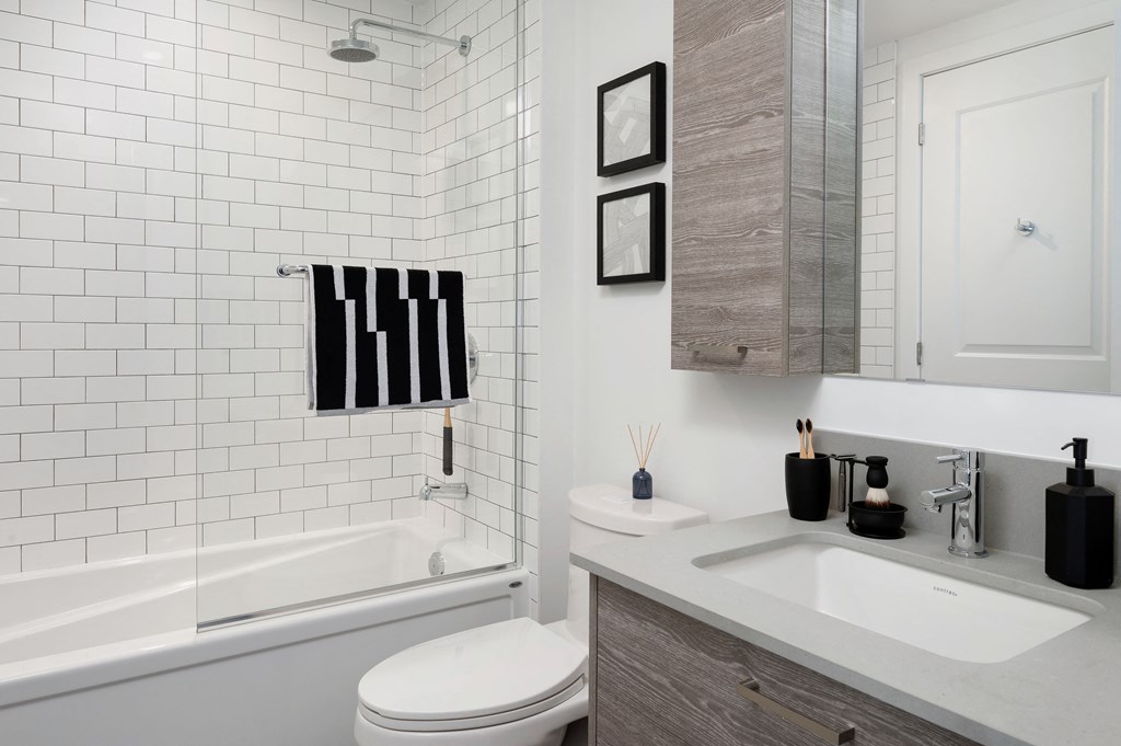 a white bathroom with a sink and a toilet