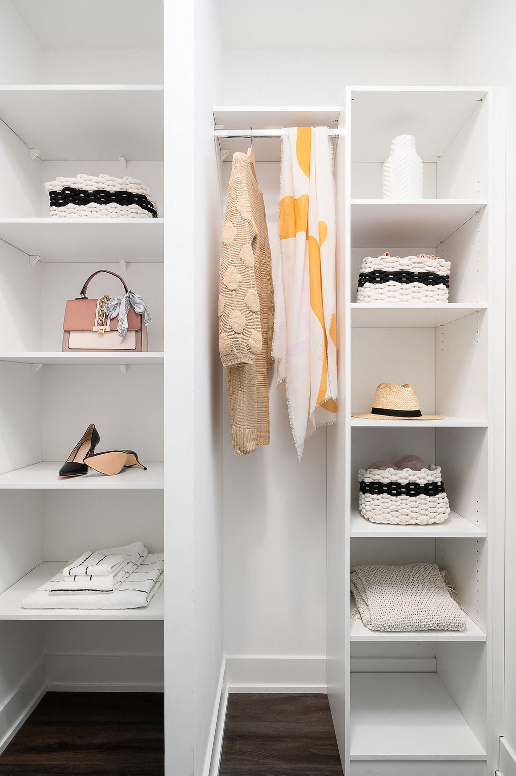 closet with clothes and accessories