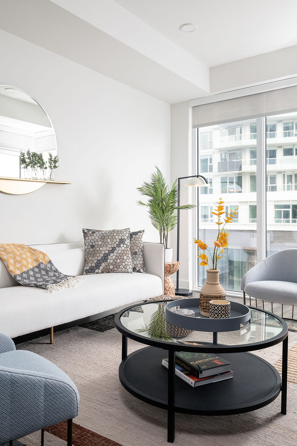 couch with circular glass coffee table