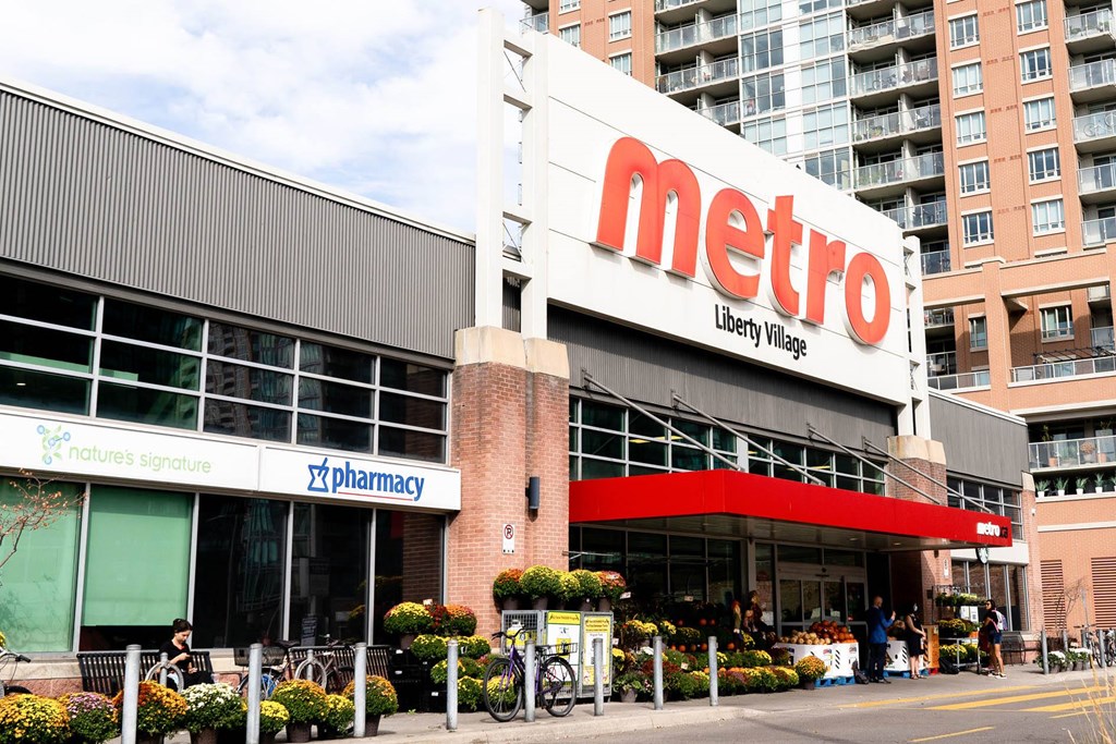 the facade of a metro grocery store on a city street