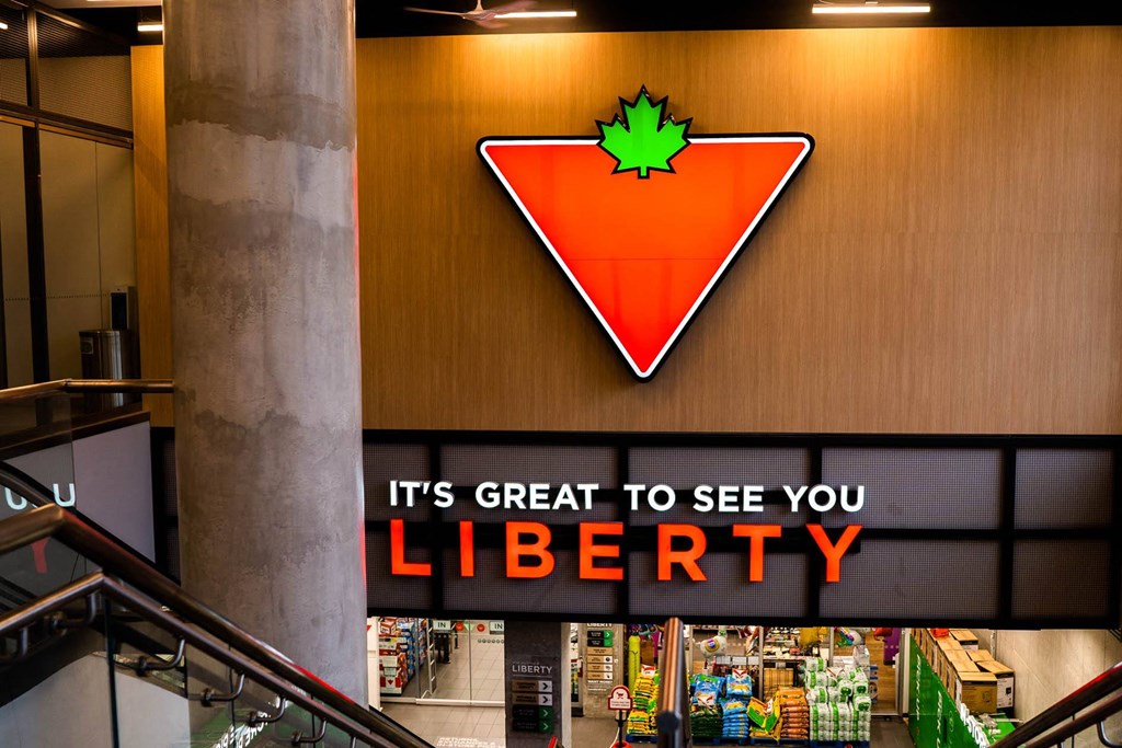 a sign for a grocery store that says it is great to see you liberty