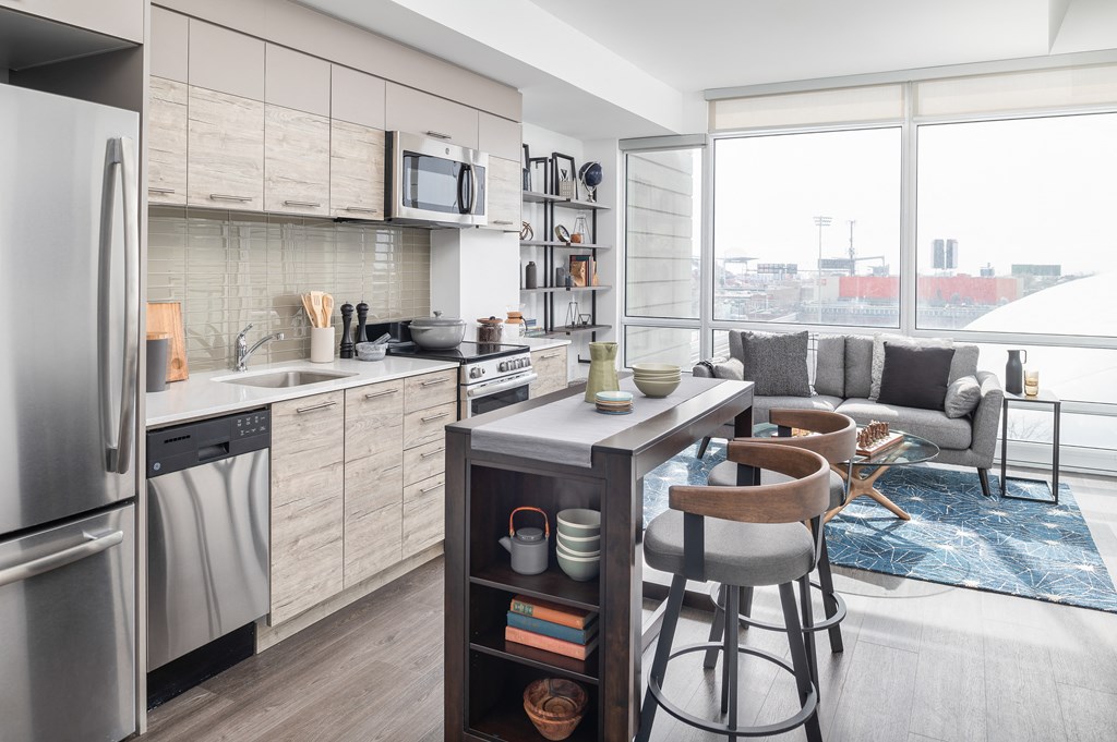 a kitchen and living room in an apartment