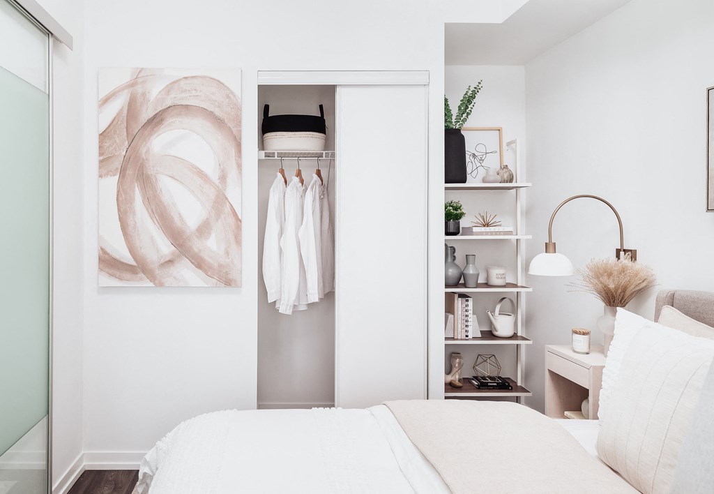 a bedroom with a bed and a closet