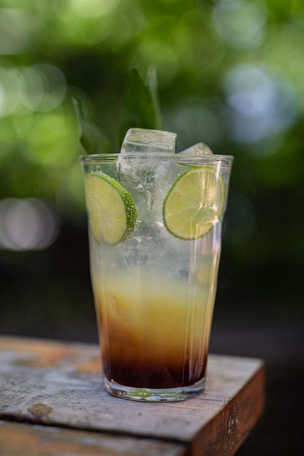 cocktail with slices of lime and ice