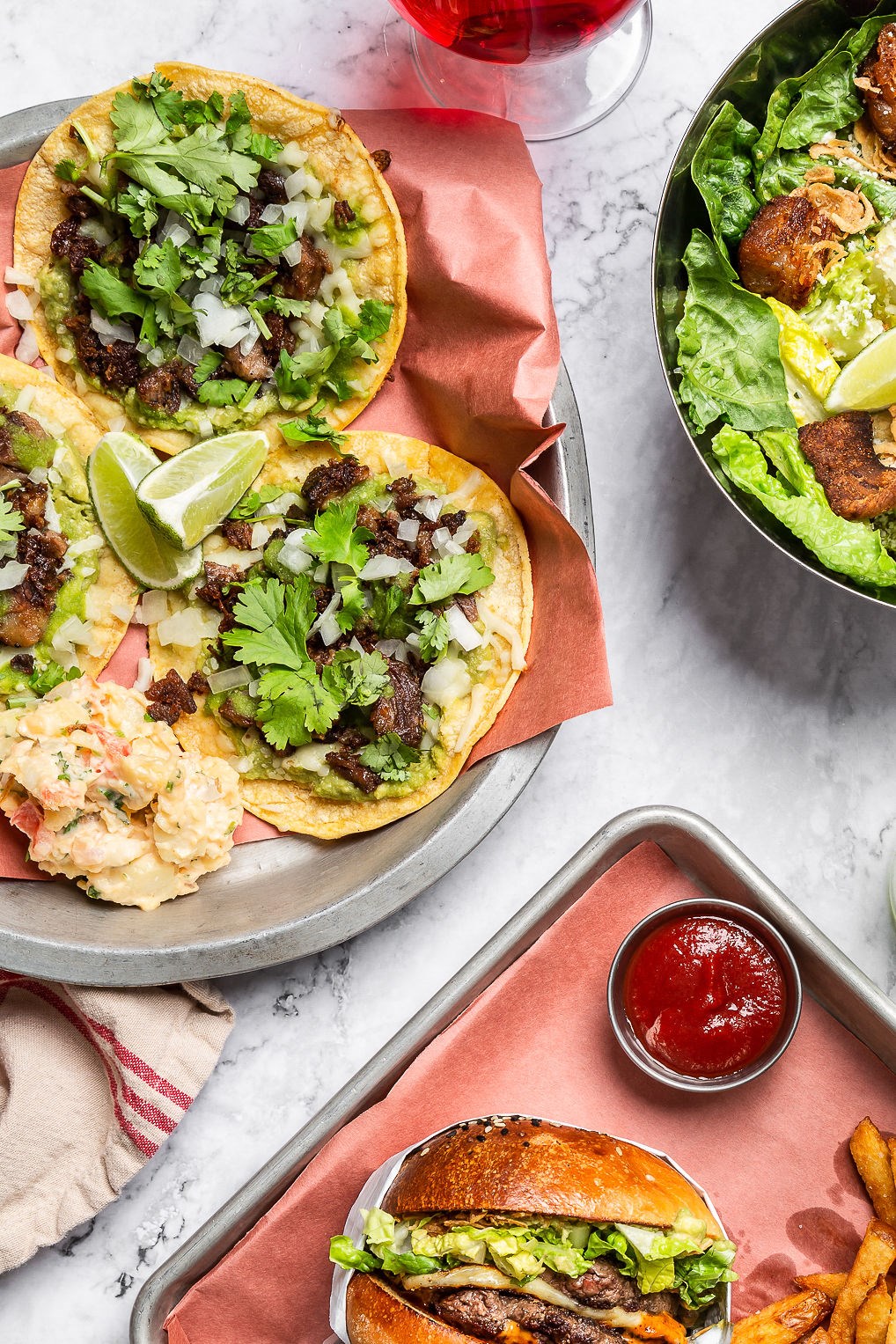 beef tacos on a plate, hamburger and fries