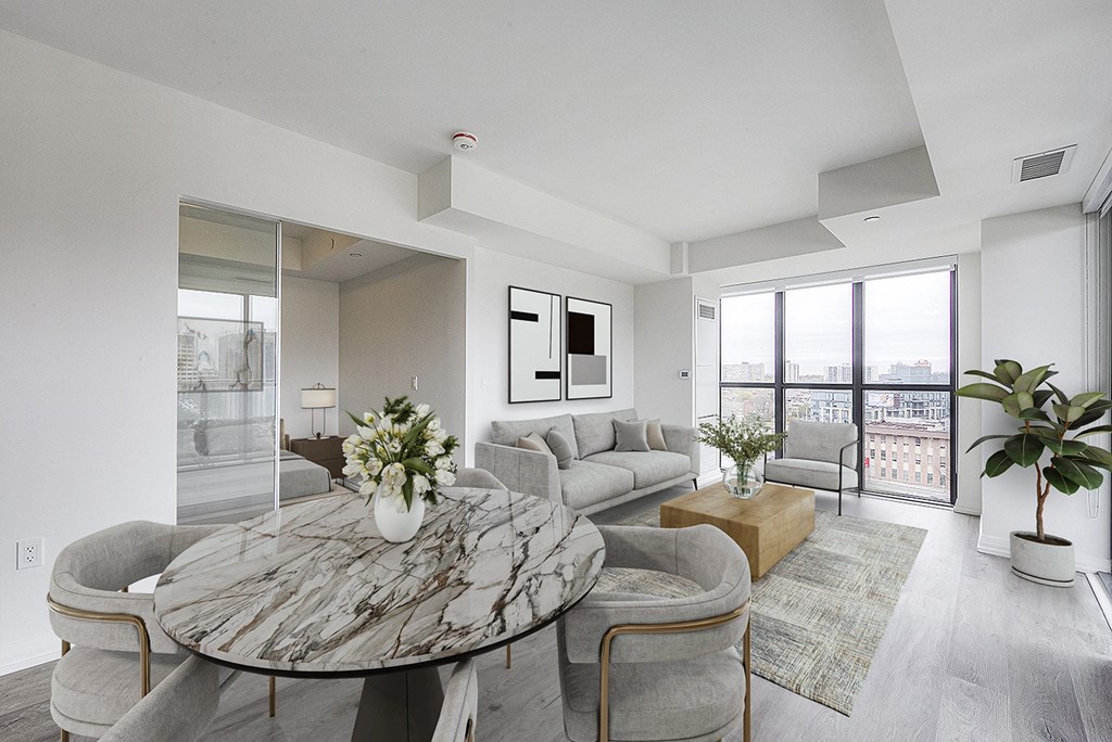 a living room with couches and a round table