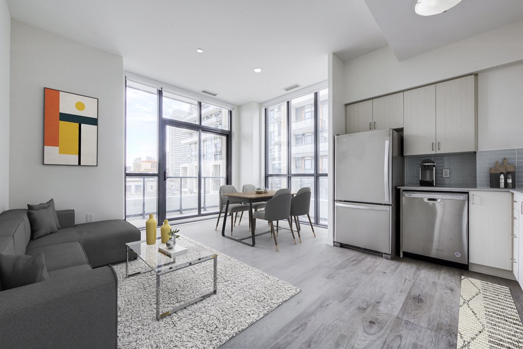 a living room with a couch and a table and a refrigerator