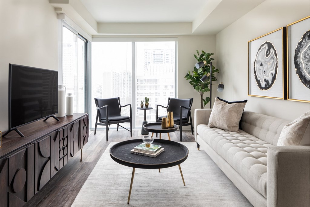 a living room with a couch and a table and a television