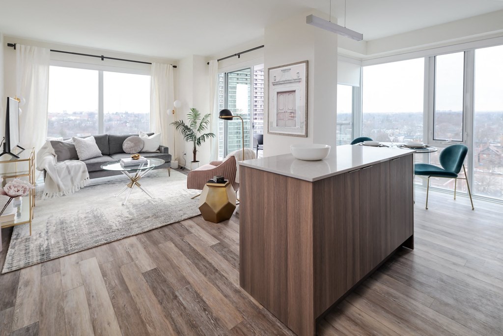 a living room with a couch and a kitchen