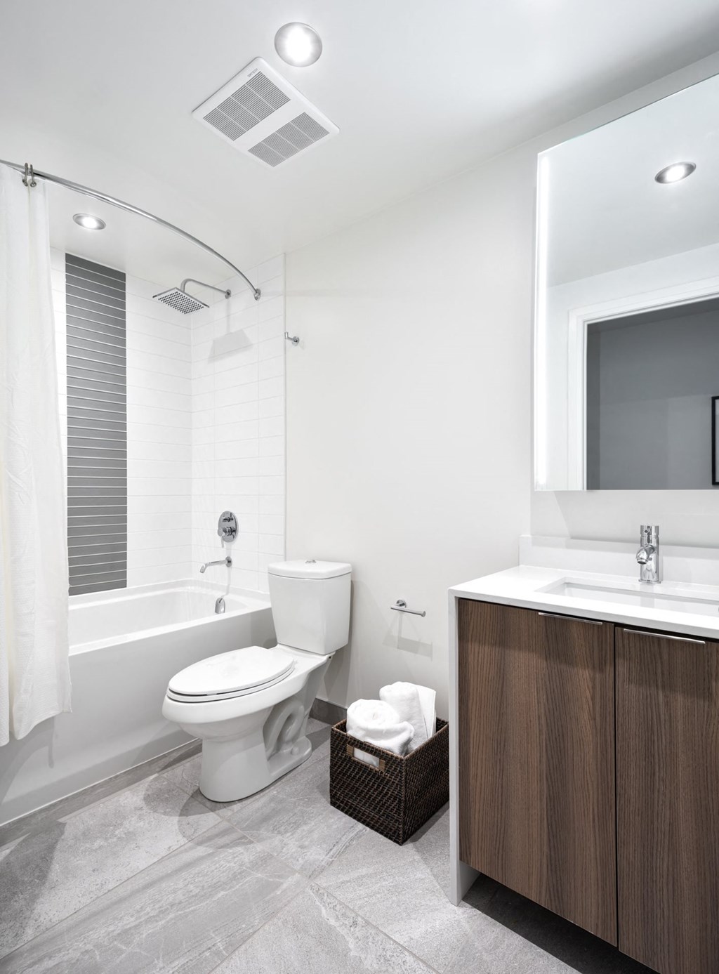 a bathroom with a toilet and a tub and a sink
