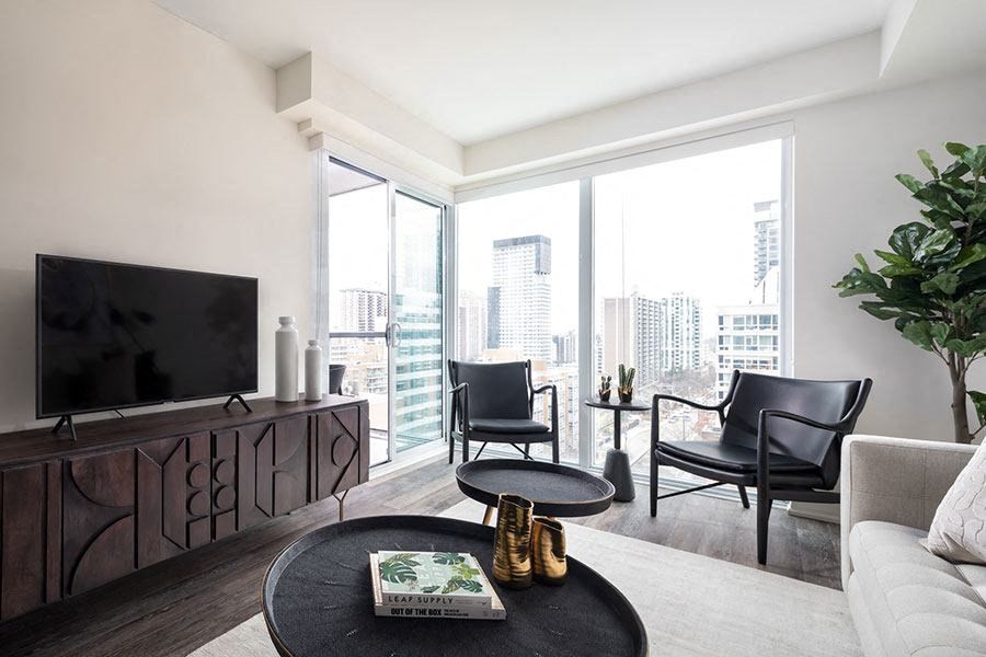 a living room with a couch and a table and a television