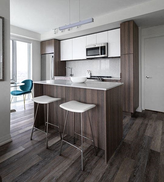 a kitchen with two stools and a counter top